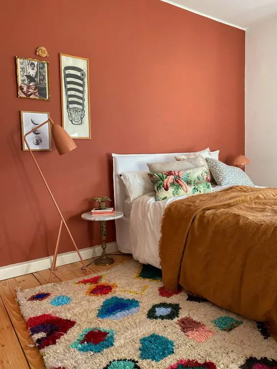 Bright Bedroom with Terracotta Wall and Eclectic Bedding