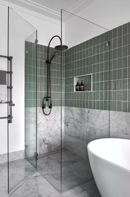 Bathroom with Green Tiles, Marble Walls, and Glass Shower Doors