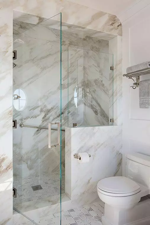 Small Chic Bathroom with Marble Walls and Glass Shower