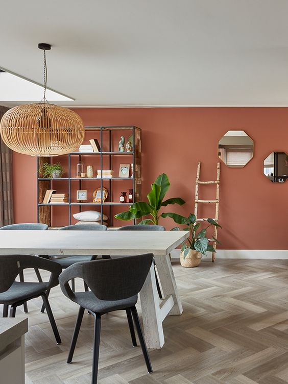 Bohemian Dining Room with Terracotta Wall and Wooden Pendant Lamp
