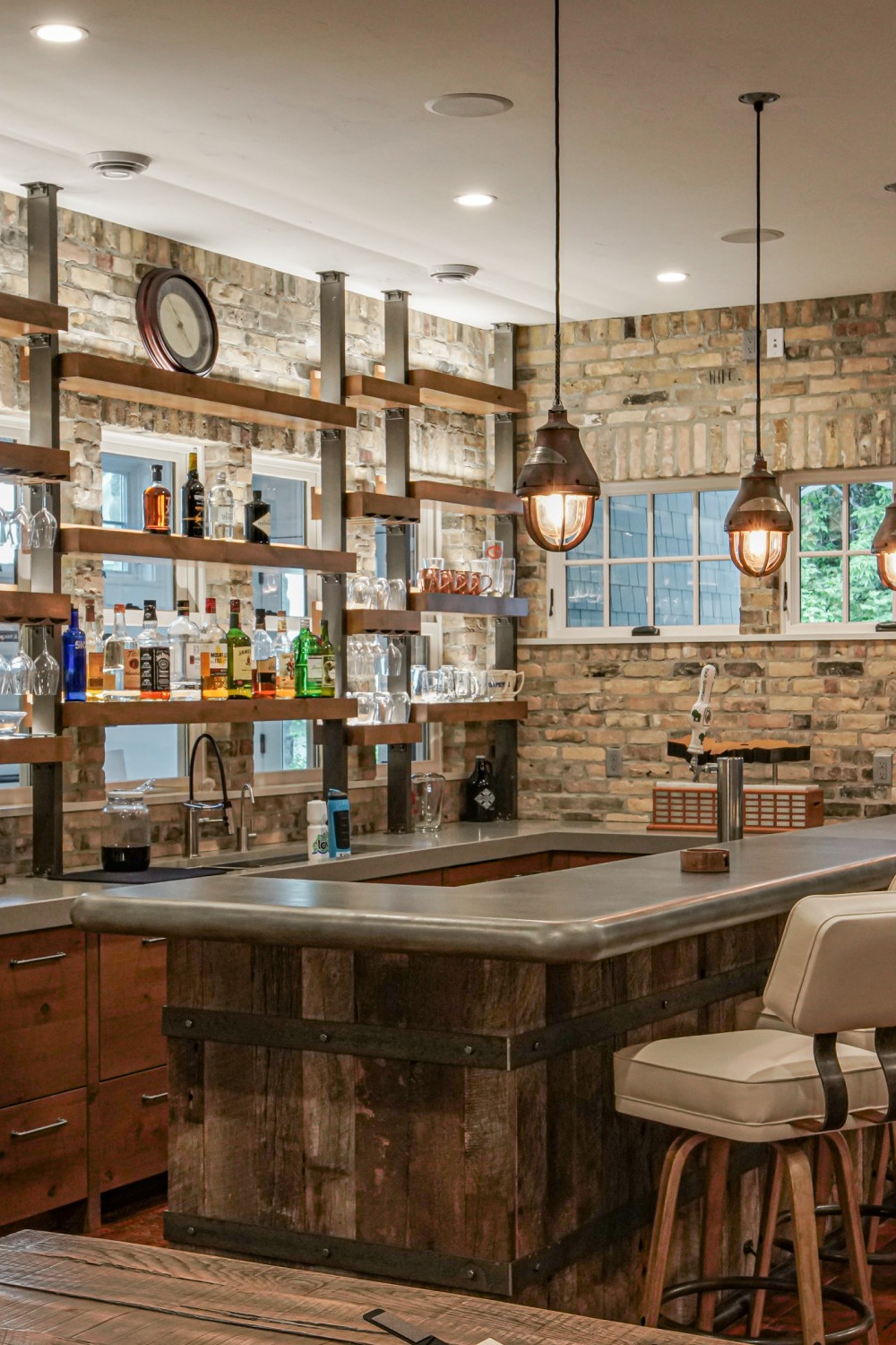 Basement Bar with Warm Lighting and Neutral Tones