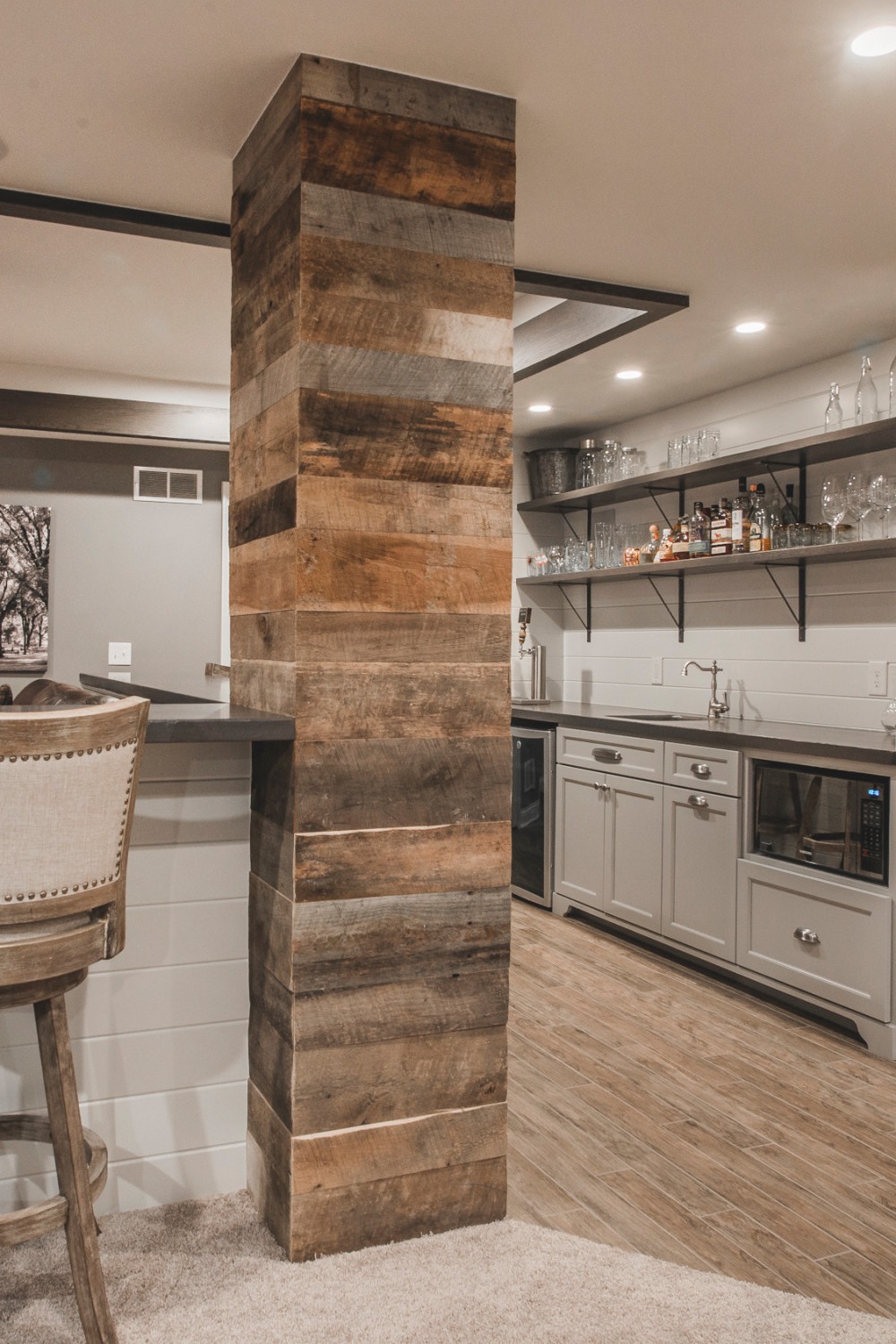 Rustic Wood Paneling Bar with Modern Countertops and Shelving