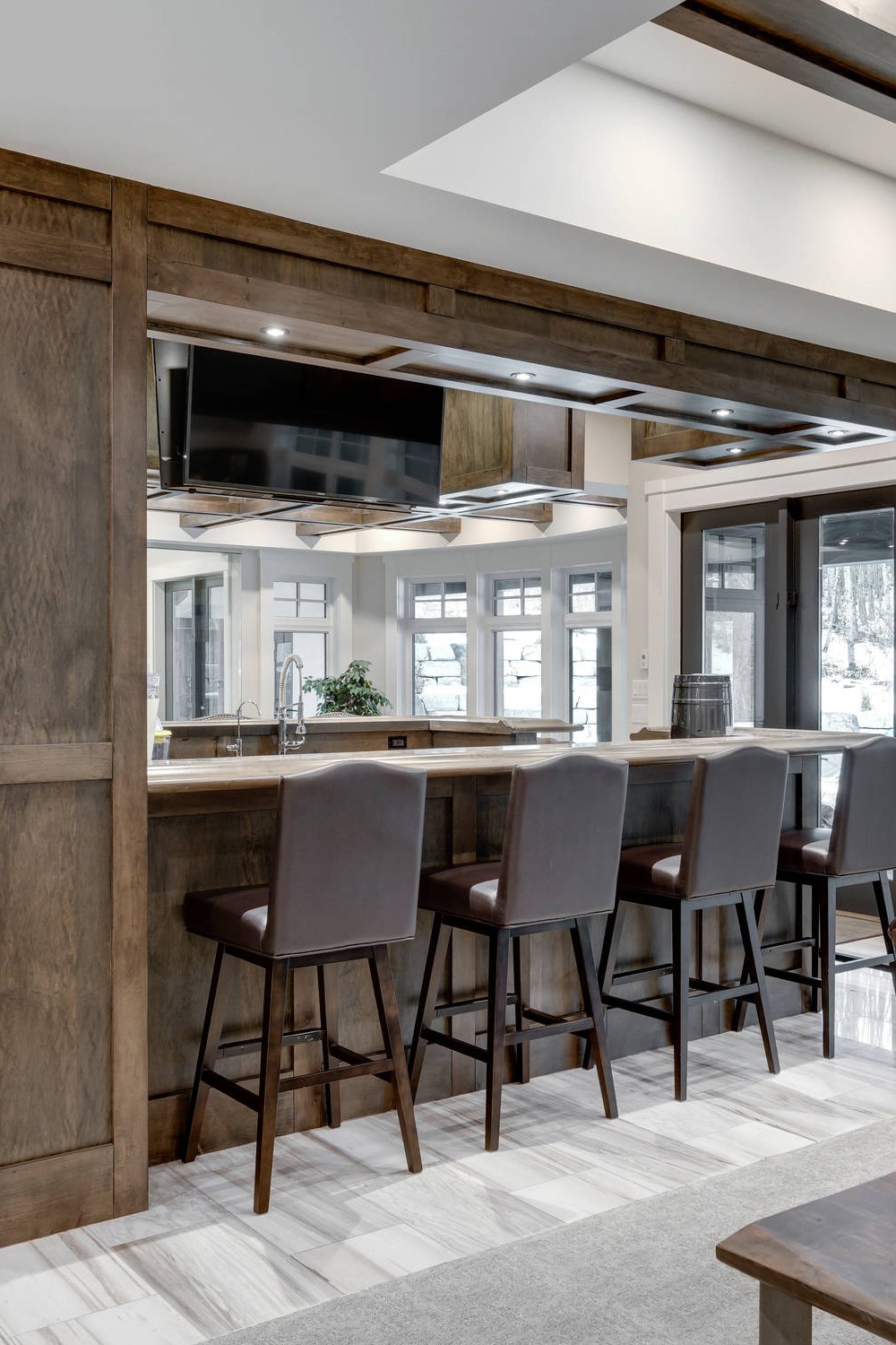 Modern Basement Bar with Neutral Cabinetry and Stone Accents