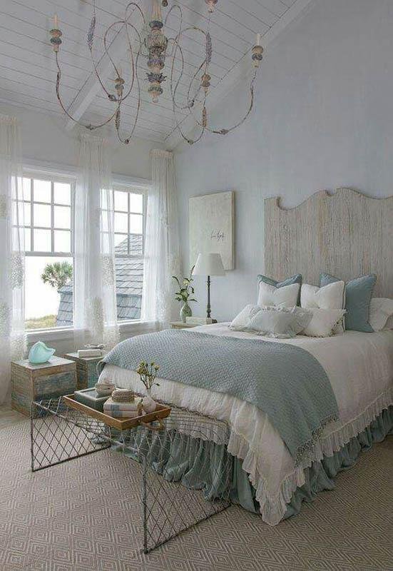 Bedroom with a Crystal Chandelier and White Bedding