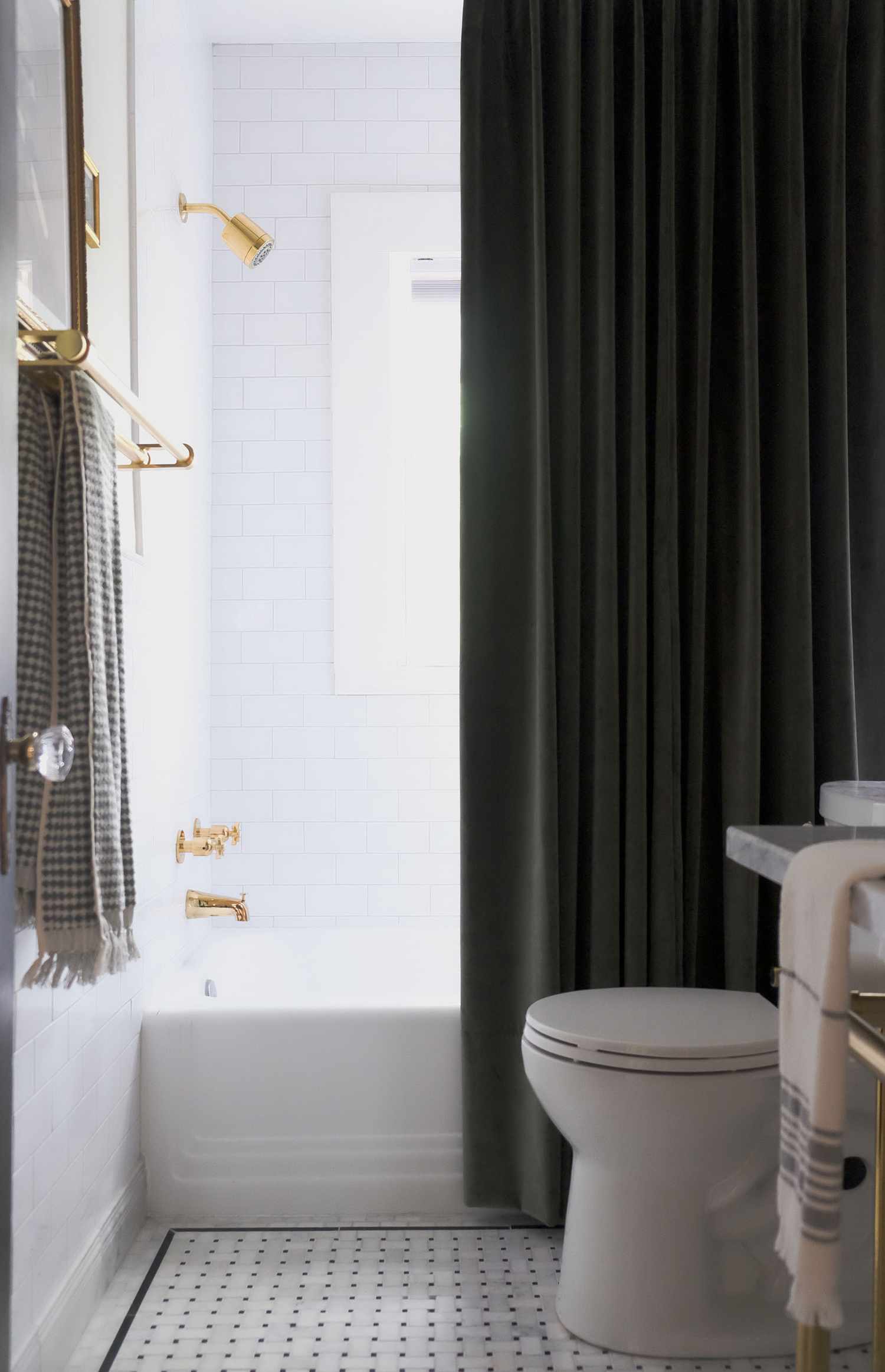 Elegant Bathroom with a Statement Freestanding Tub and Bold Fixtures