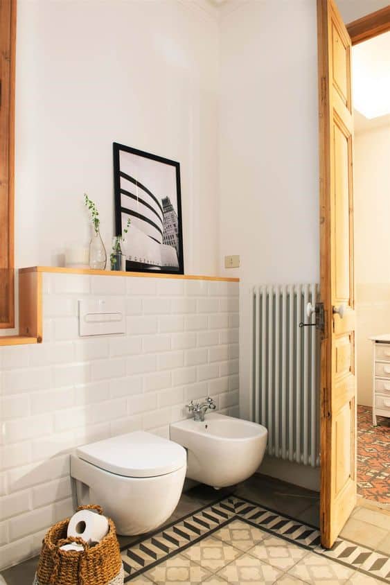 Bathroom with Layered Artwork Above Bathtub