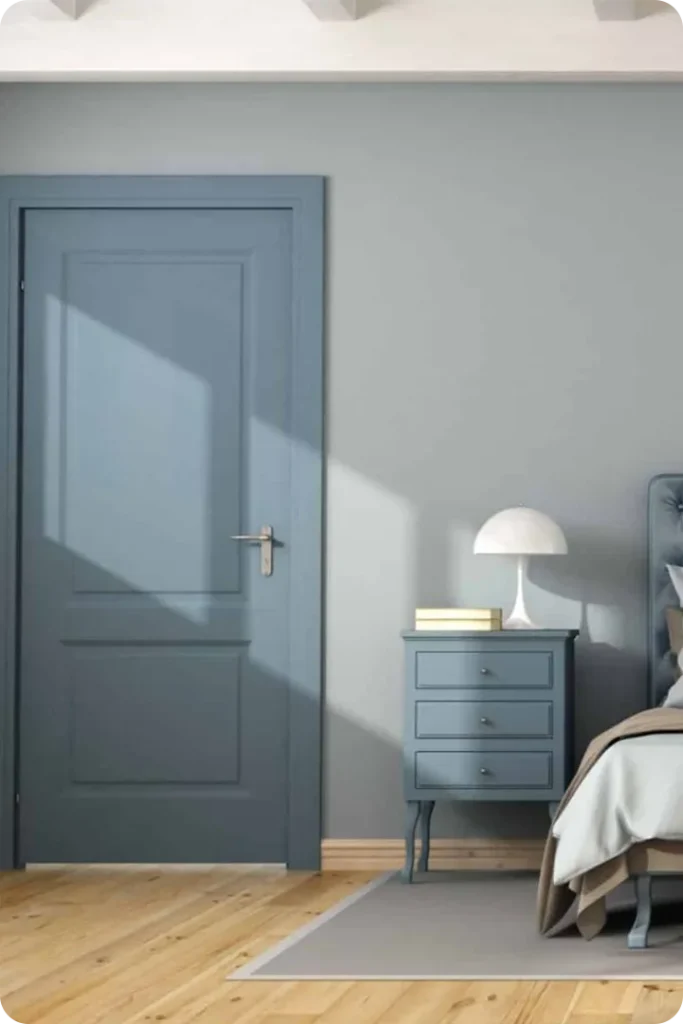Light Blue Door Framed by White Trim and Stone Details
