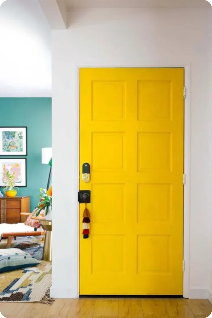 Bright Yellow Front Door Framed by Neutral Siding