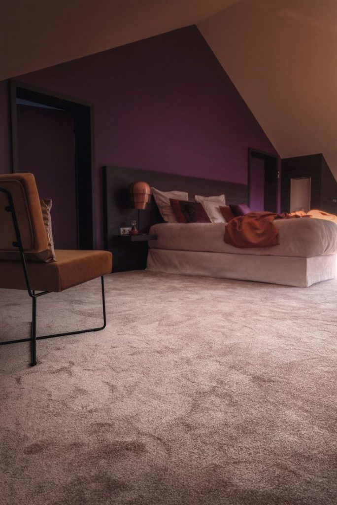 Dreamy Bedroom with Soft Floral Accents and Warm Carpeting