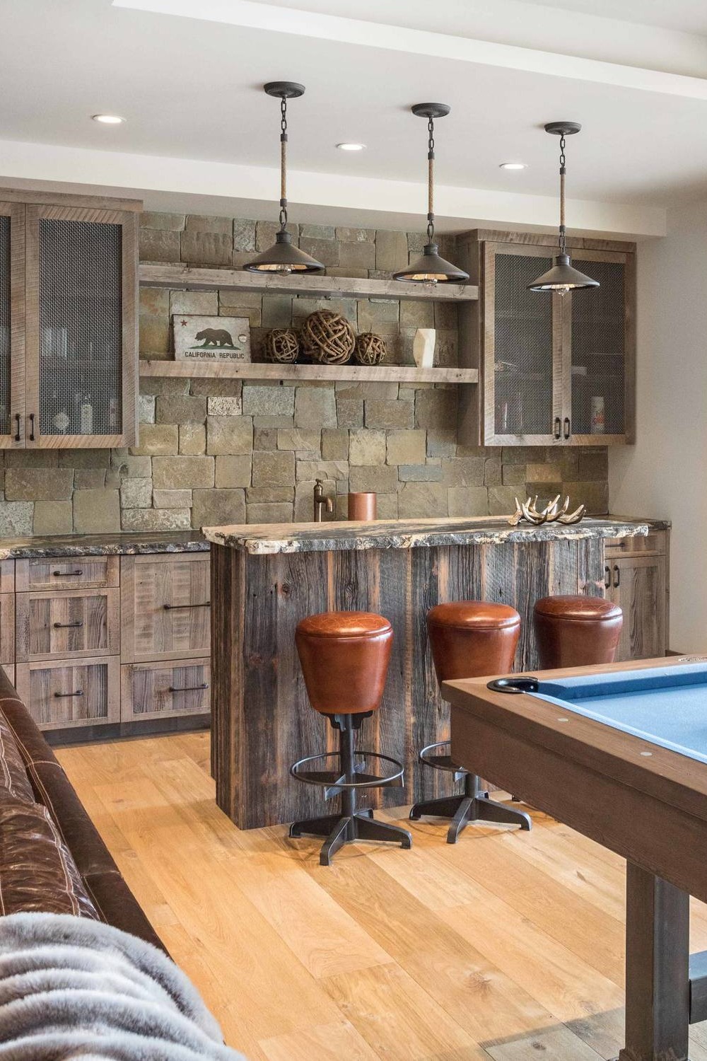 Basement Bar Design with Stone Accent Wall and Wood Elements