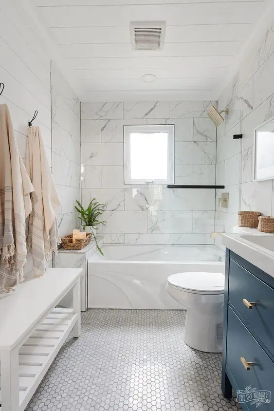 Beach Bathroom with White Marble and Navy Vanity