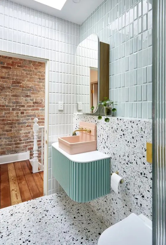 Bright Bathroom with Mint Tiles and Pink Sink
