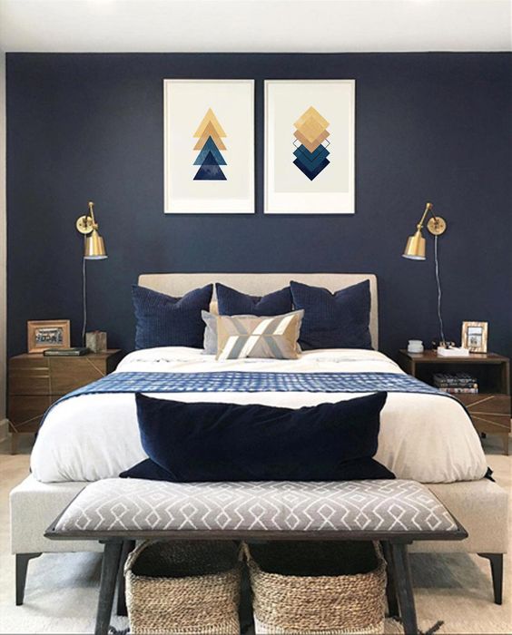 Moody Bedroom with Navy Walls and Gold Accents