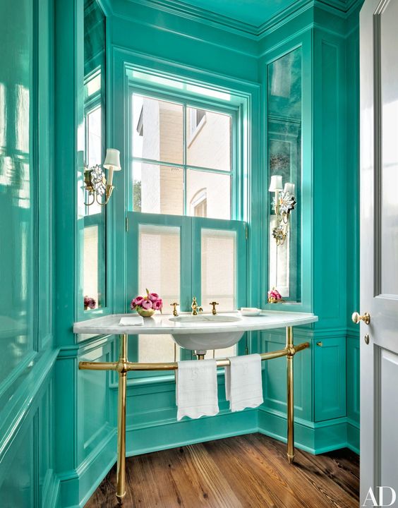 Vintage Bathroom with Turquoise Walls and Gold Accents