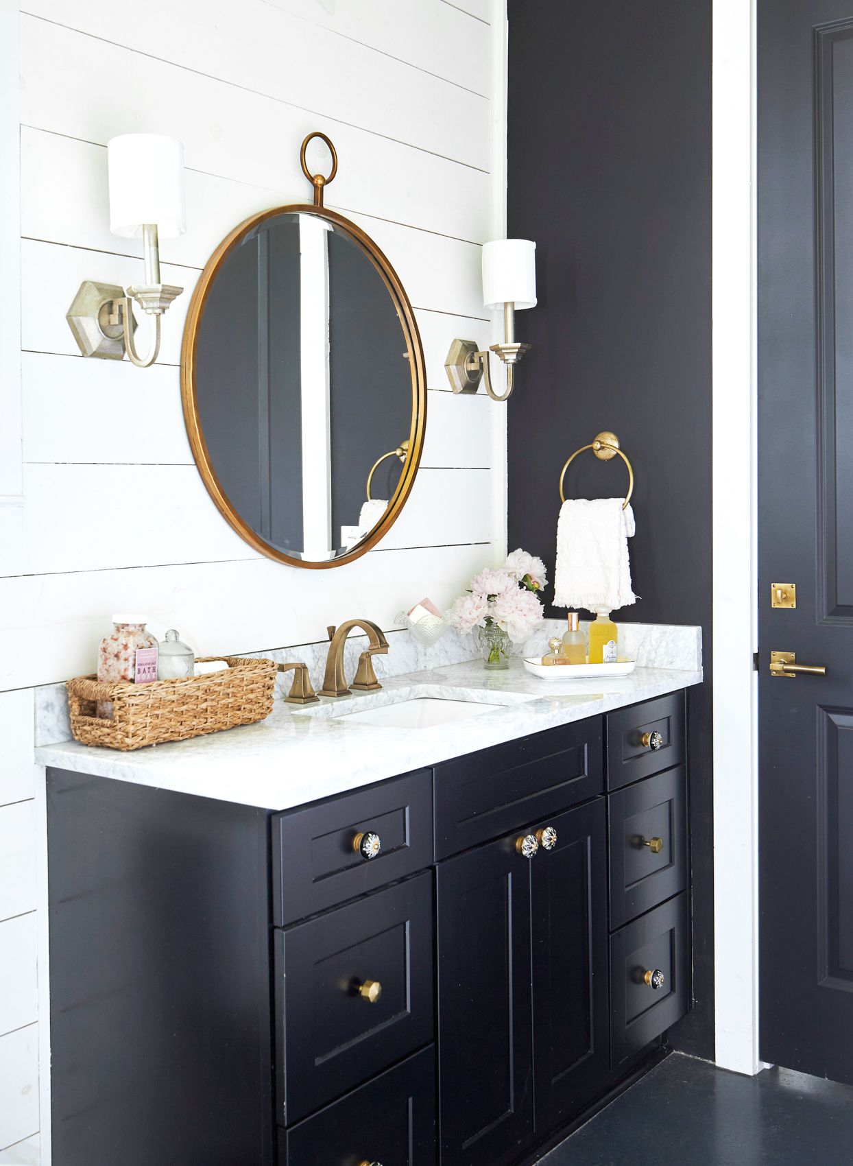 Cozy Bathroom with Black Corner Vanity and White Shiplap Wall