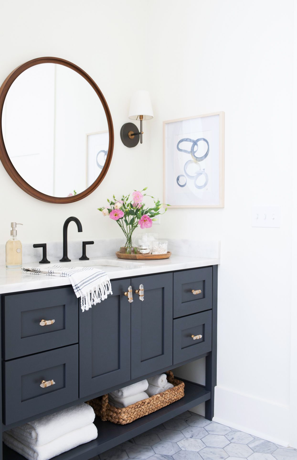 Corner Vanity Bathroom with a Round Mirror for Softened Elegance