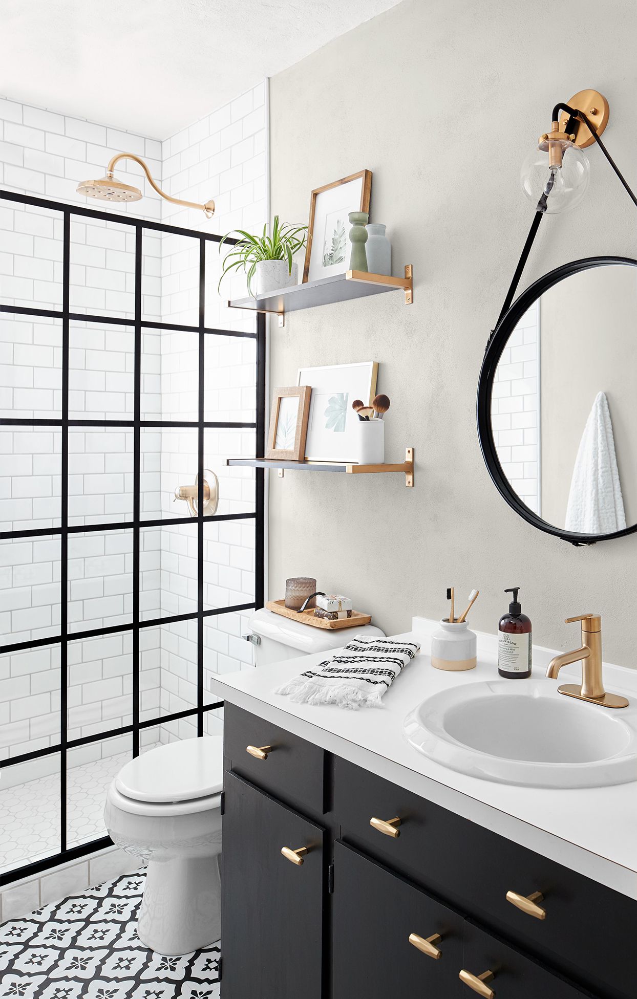 Modern White Bathroom with a Black-Framed Mirror and Glossy Fixtures