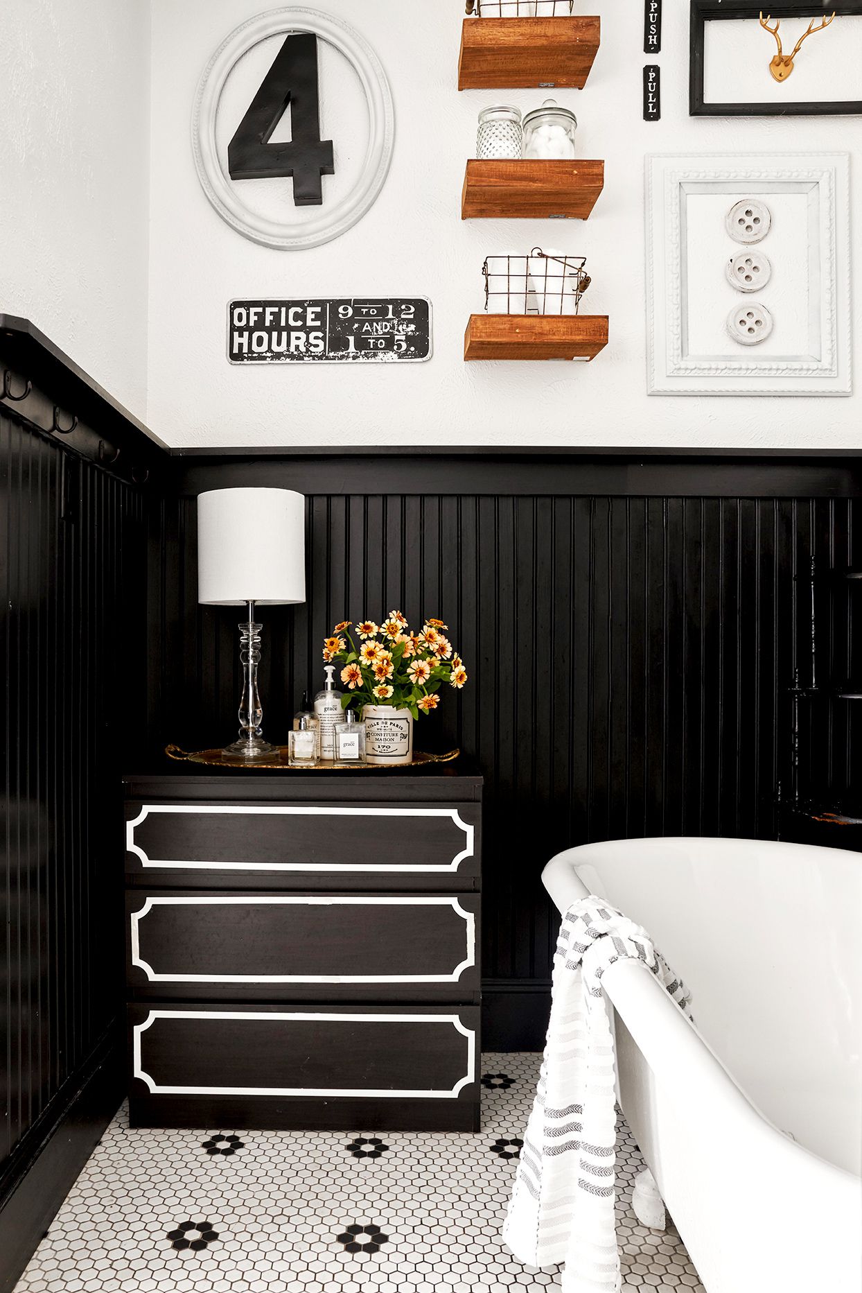 Bright White Bathroom with Black Patterned Floor Tiles