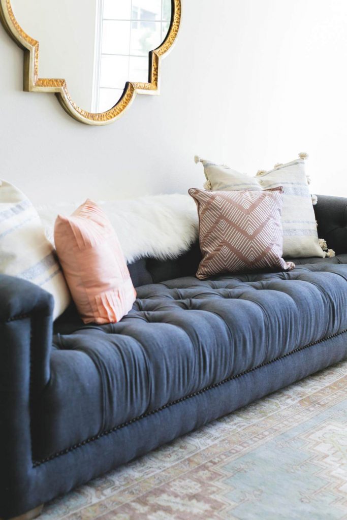 Mirrored Wall Decor Above a Sofa