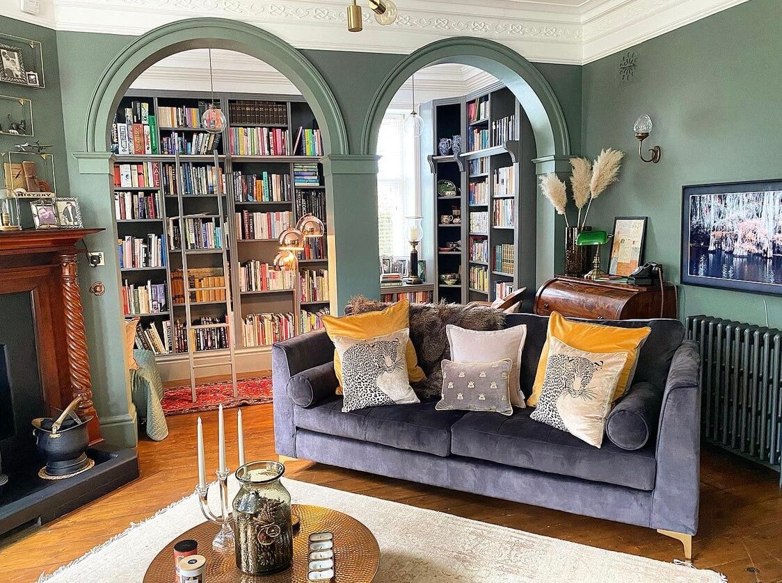 Green-Toned Attic Library with Elegant Arches