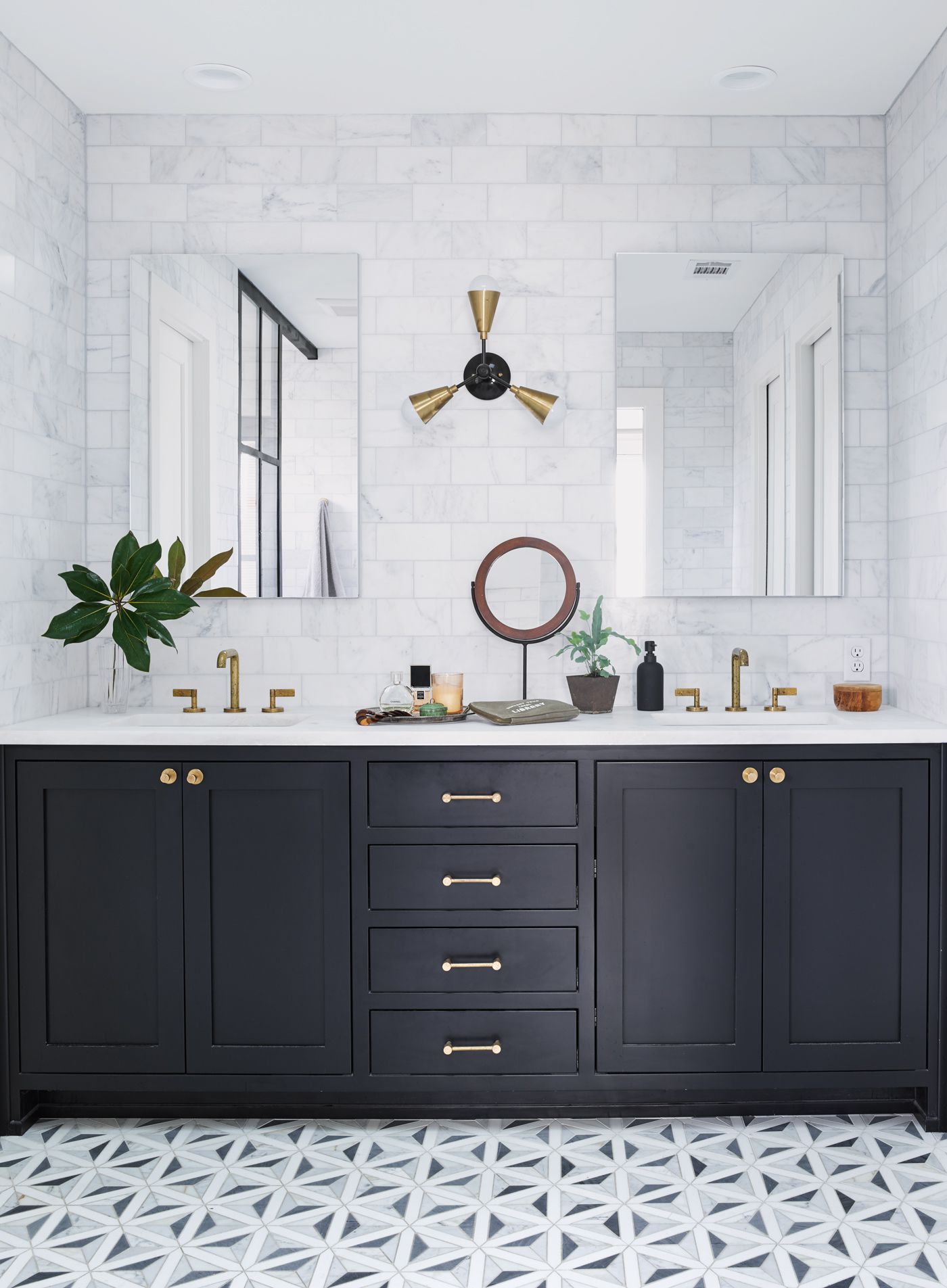 Modern Bathroom with a Double Vanity and Wall-to-Wall Mirrors