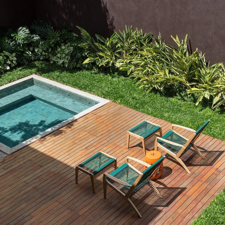 Backyard Pool with Wooden Deck Design
