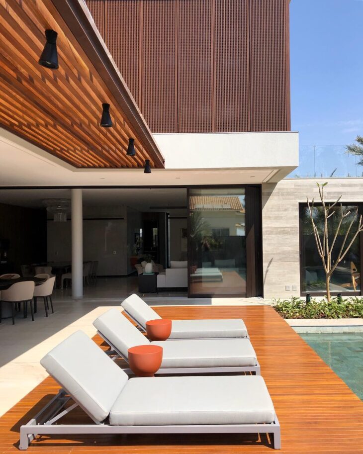 Rustic Backyard Pool with Extensive Wooden Decking