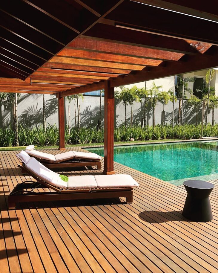Rustic Poolside Design with Multi-Level Wooden Deck