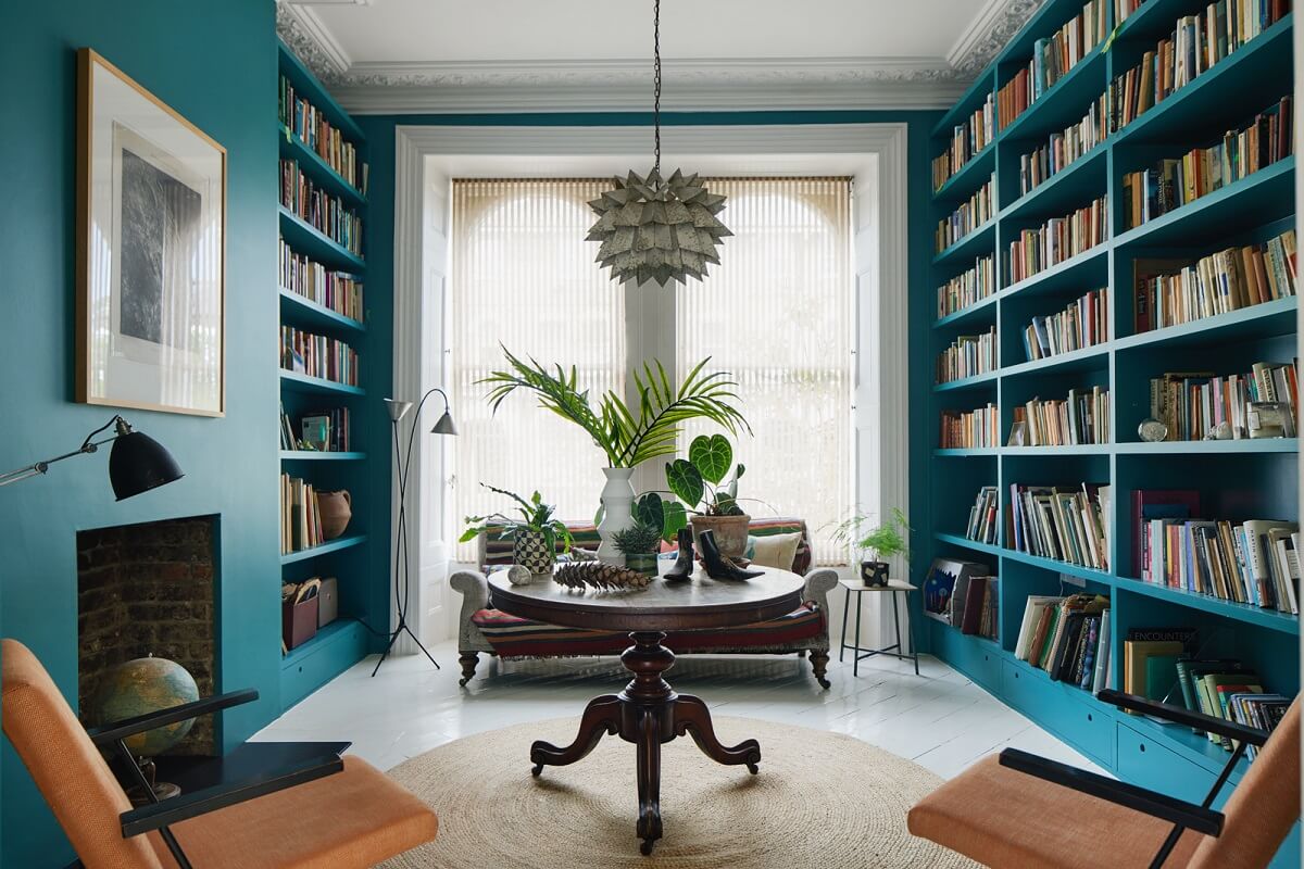 Vintage Attic Library with a Fireplace and Antique Touches