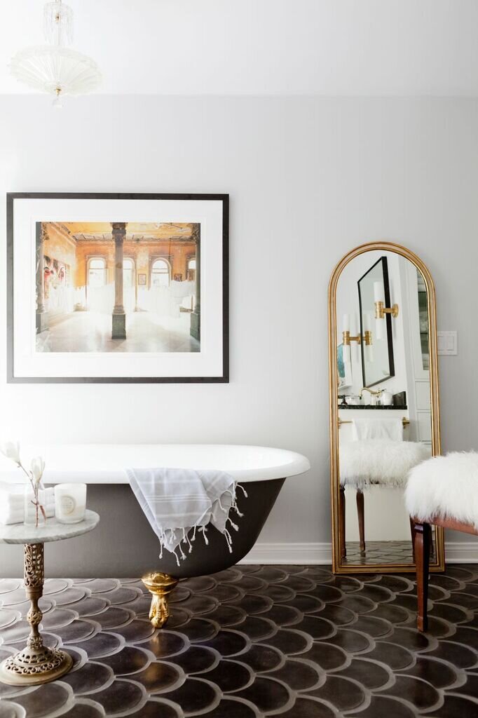 Elegant Bathroom Featuring Black Fish Scale Tiles and a Marble Vanity