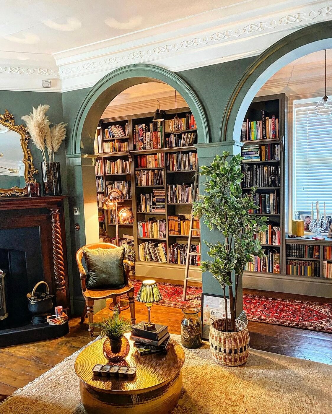 Attic Library with Green Accents and Arched Shelving