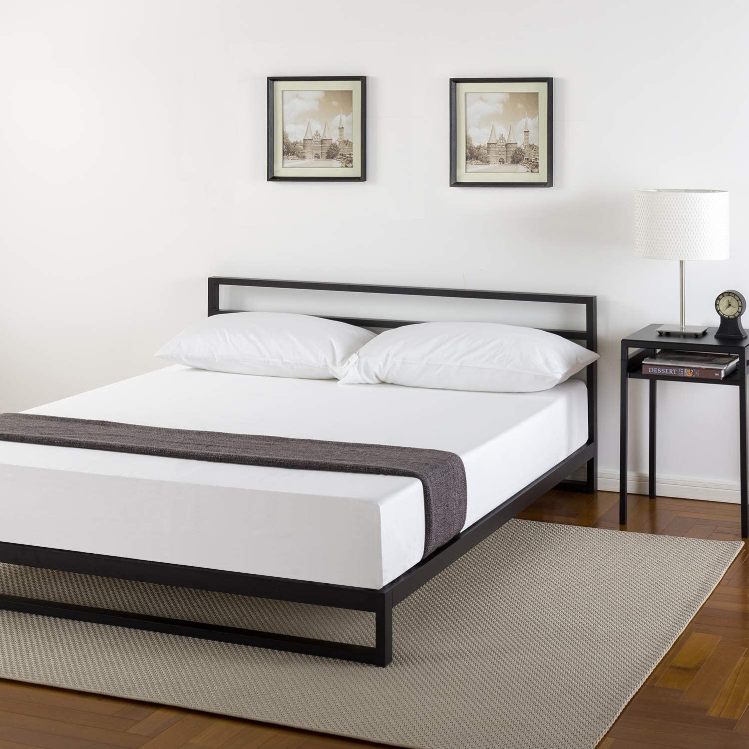 Dark Metal Bed Frame with Bold Green and Textured Linens