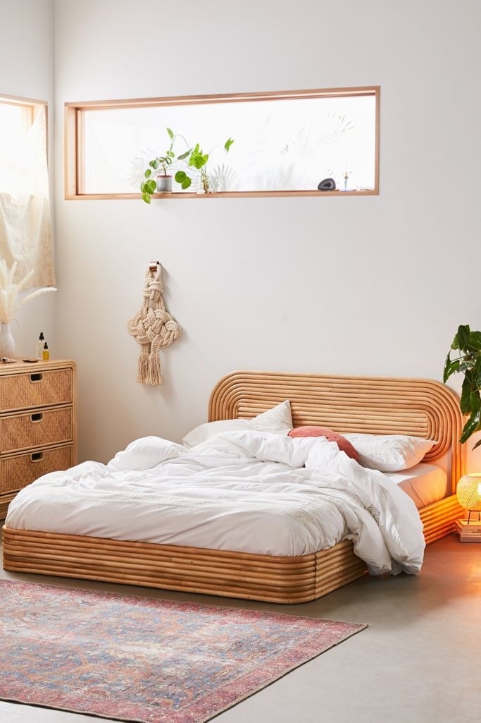 Industrial Metal Bed Frame with Earthy Textiles